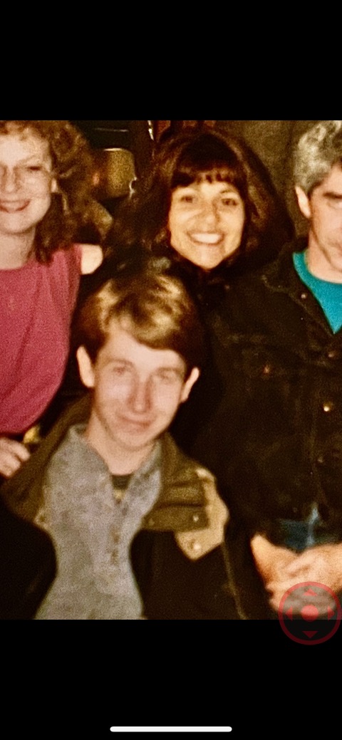 A vintage family photograph of Elliot as a boy with relatives